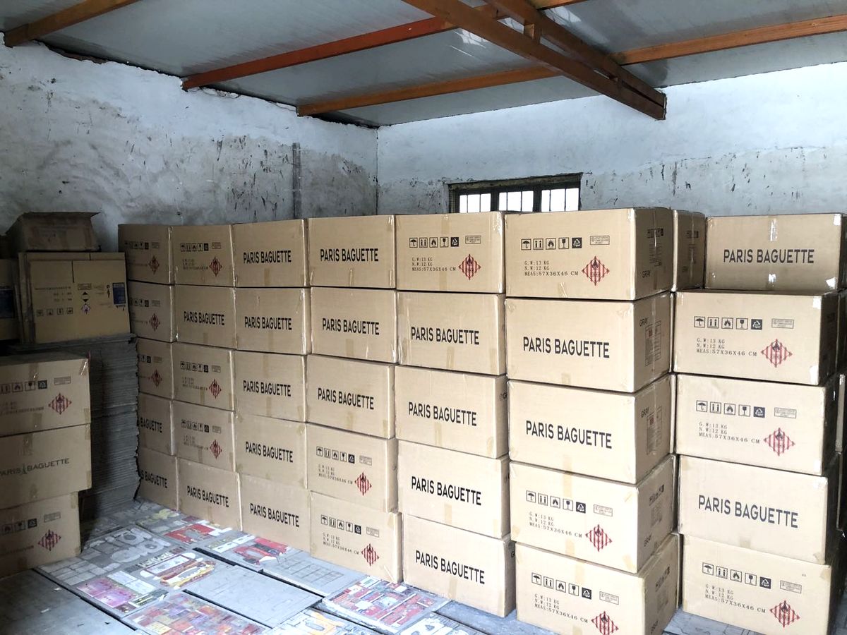 Paris Baguette branded export cartons of matchboxes stacked in the warehouse ready for shipment